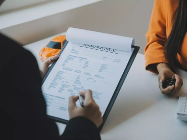 insrance agent filling in form