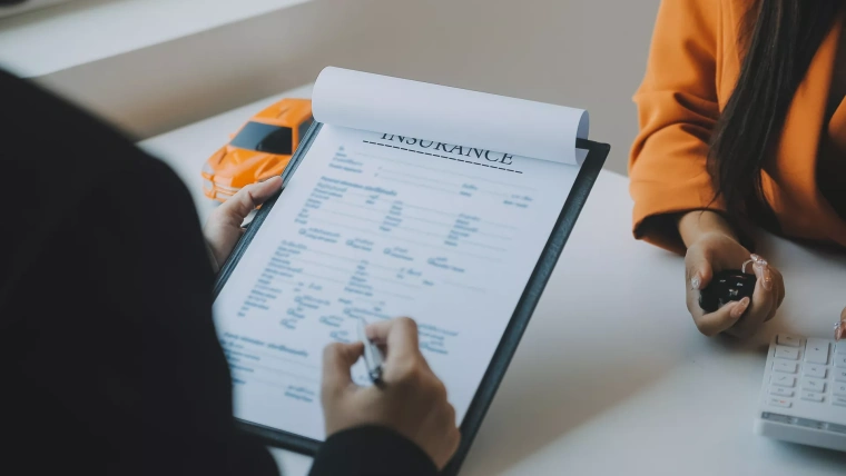 insrance agent filling in form