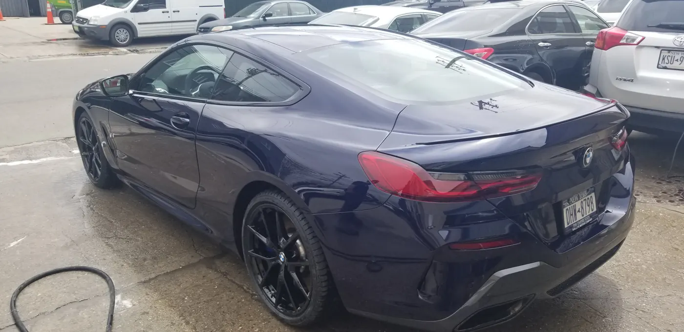 The same BMW 8 Series after collision repair and refinishing